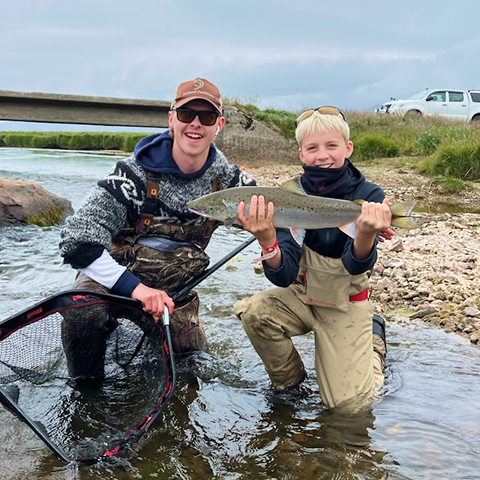 Magnús holding a Salmon in September